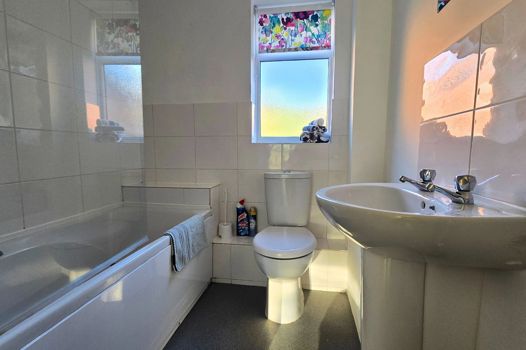 Full bathroom with bath and heated towel rail