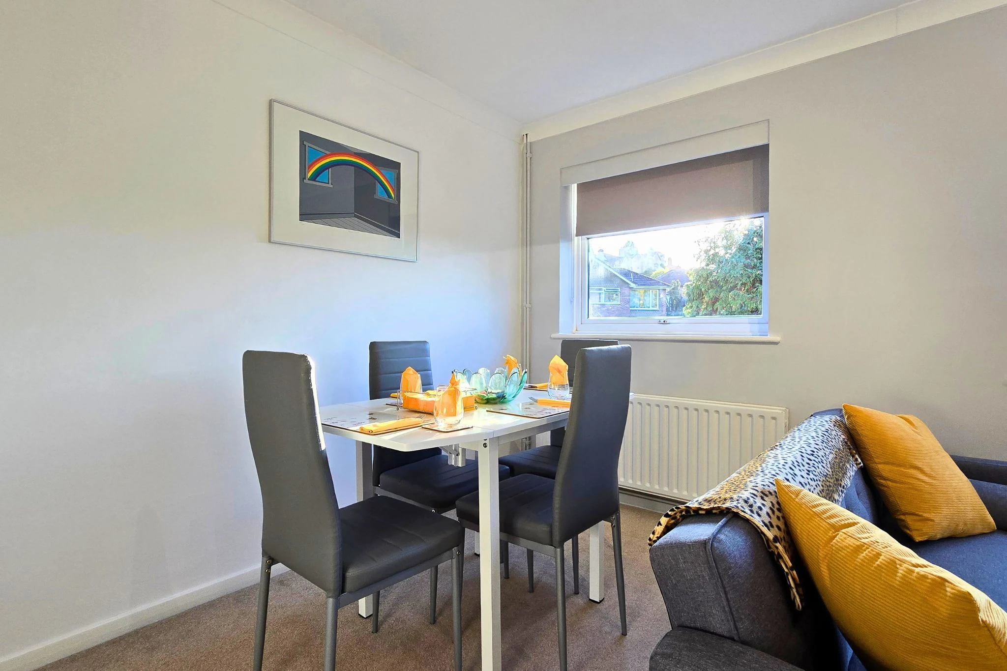Dining table and chairs beside the living space
